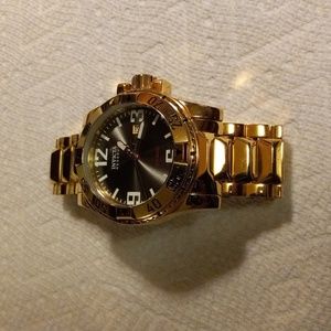 Gold Invicta Reserve pre own excellent condition.